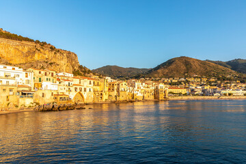 Cefalu, Sicily - Italy - July 7, 2020: Sunset over the medieval old town of Cefalu in Sicily in...
