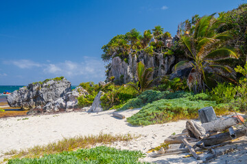 White sand beach with palms, temple of the descending god, Mayan Ruins in Tulum, Riviera Maya,...