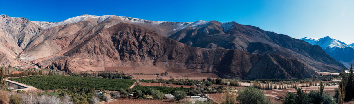 Paiguano or Paihuano panorama view of vineyards and snowy mountains in winter, Valle del Elqui in Elqui Province, Coquimbo Region..