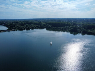 Aerial view of sailing boat on lake in Hertfodshire