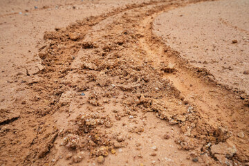 Background roy wheel motorcycle on the road, the sand is wet