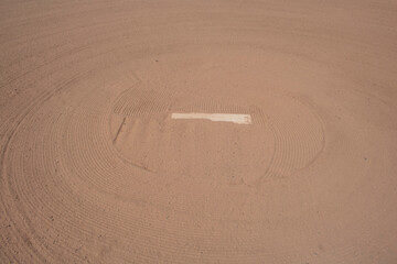 baseball pitchers' white standing  slate bond mound with clay and freshly raked