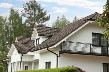Modern building with brown roof outdoors on spring day