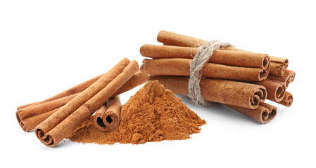 Aromatic cinnamon sticks and powder on white background