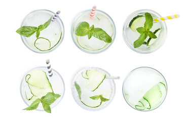 Set of glasses with refreshing cucumber water on white background, top view