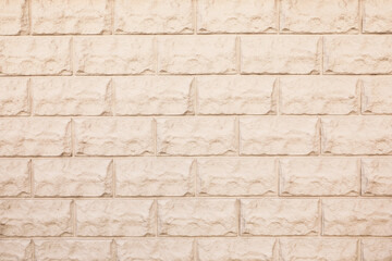 Texture of beige brick wall as background