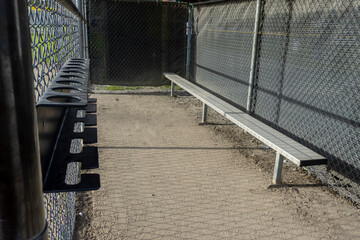 Angled view of the dugout on a baseball field, without any people around - obrazy, fototapety, plakaty