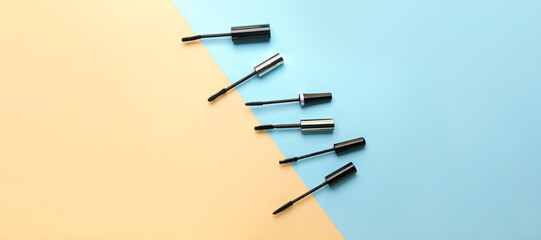 Black mascara on color background. Banner for design