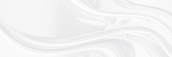 White gray satin texture that is white silver fabric silk panorama background with beautiful soft blur pattern natural.