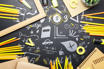 Set of school supplies on chalkboard