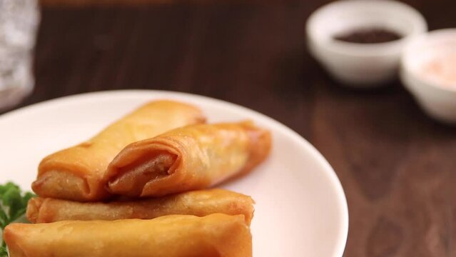 Spring rolls of fried Chinese food that spins on the table