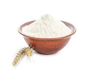 Bowl of flour and wheat ears on white background