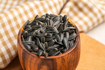 Bowl of black sunflower seeds, closeup