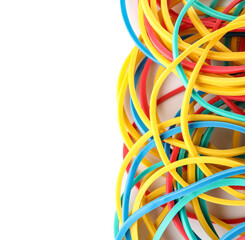 Many colorful rubber bands on white background, closeup