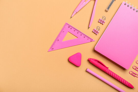 Set Of Pink Stationery On Color Background