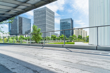 empty pavement and modern buildings in city