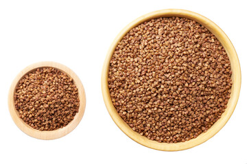 Raw buckwheat in a wooden bowl isolated on white background top view.