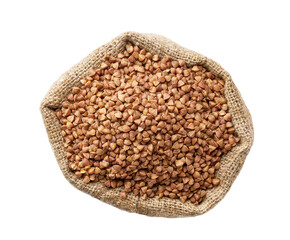 Raw organic buckwheat in sack isolated on white background top view.