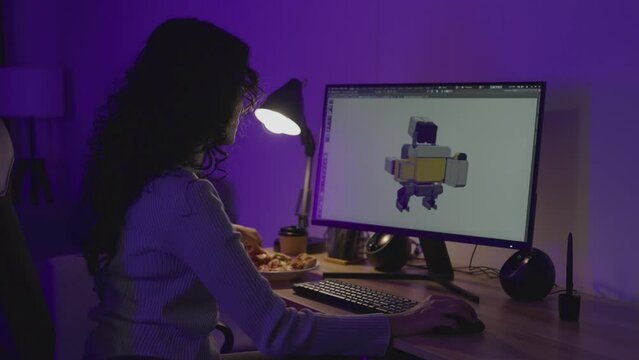 Asian Female Freelancer Working with Inspiration in her Studio. Concentrated Woman Creating her Own Project, She makes Games Designed by 3D Animation Software.
