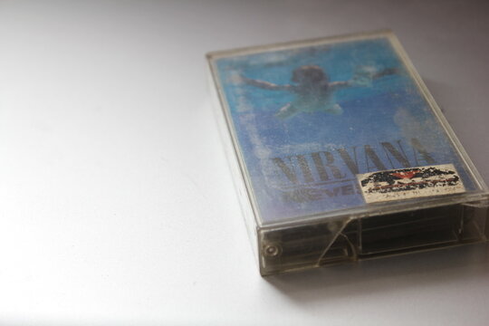 Bangkok, Thailand - 22 January 2022 : Nirvana Album's 90s cassette tape "Nevermind" on gray background.