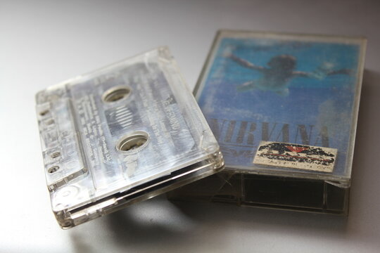 Bangkok, Thailand - 22 January 2022 : Nirvana Album's 90s cassette tape "Nevermind" on gray background.