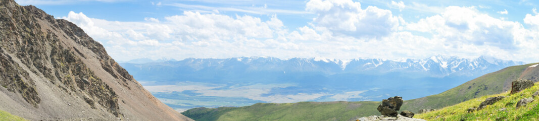 Beautiful panoramic landscape of mountains and alpine meadows, banner format