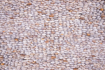Pebble stone floor tile seamless background, Orange pebble and white pebble.