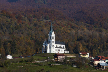 Fototapeta na wymiar Basilica of Town Dreznica under mount Krn in Julian Alps Slovenia