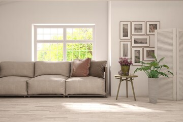 Minimalist living room in white color with sofa and summer landscape in window. Scandinavian interior design. 3D illustration