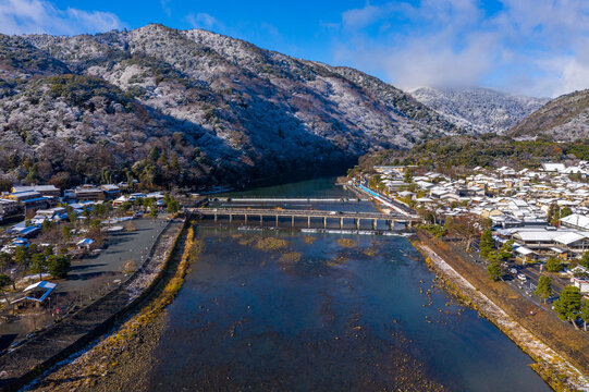 Beautiful Arashiyama Japan, Snow Over Mountains and River Early in the Morning