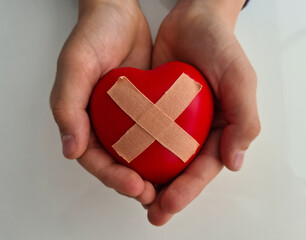 Wounded heart in children hands. Heart disease in children symptoms and treatment