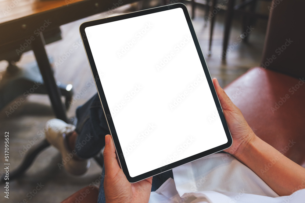 Poster Mockup image of a woman holding digital tablet with blank white desktop screen