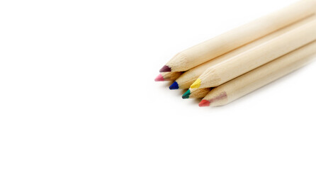Obraz premium Wooden coloured pencils concept art, text and office copy space. Isolated on white background.