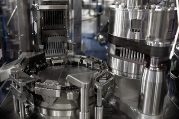 Capsule pills filling and packing machine in pharmaceutical manufacturing factory.