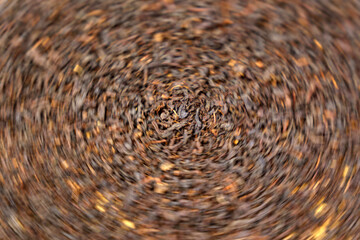 Dry black tea leaves close up. Dark background. Food and drink. Selective focus