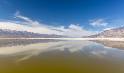 Scenic Owens lake and salt flats landscape, surrounded with Sierra mountains in California.