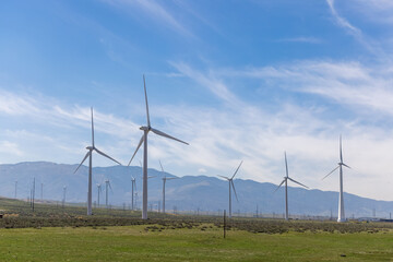 Windmill farm generates renewable energy near Mojave desert in California.