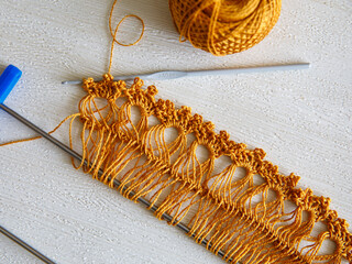 Ribbon for making lace on Adjustable crochet fork, crocheting hook and yellow brown golden cotton...