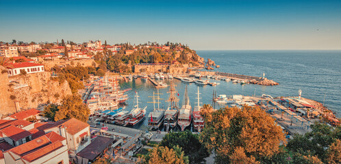 Aerial sunset view of the picturesque harbor with marina port with cruise tourist ships near the...