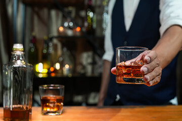Bartender Serve Whiskey, on wood bar, 