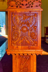 Traditional religious carved wooden decoration inside church.