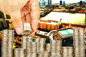 Exposure of Finance and Saving money banking concept,Hope of investor concept,Male hand putting money coin like stack growing business. background the city