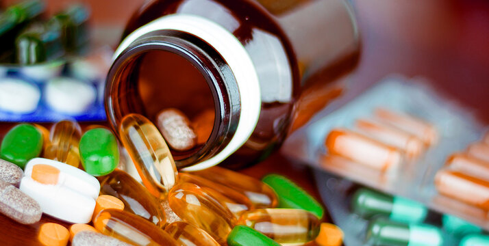 Drug prescription for treatment medication. Pharmaceutical medicament, cure in container for health. Pharmacy theme, capsule pills with medicine antibiotic in packages.