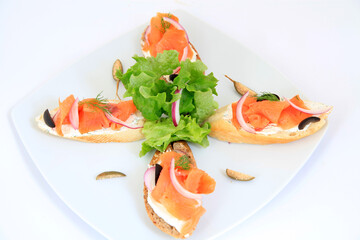 sandwiches with salmon with decoration. Tapas food