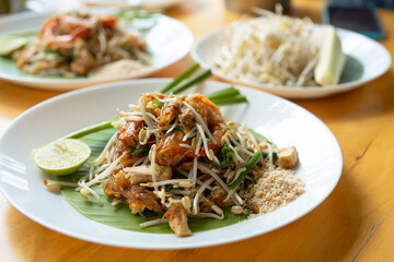 Close-up of Pad Thai Seafood, a dish made from noodles, is a famous dish of Thailand recommended for tourists visiting the country. It consists of rice noodles and shrimp and squid.