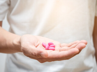 Close-up medicine pills in man hand