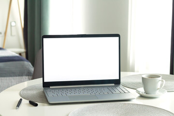 Open laptop with blank monitor screen mockup