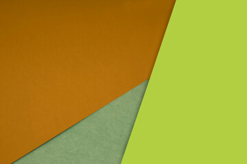 Dark and light, Plain and Textured Shades of yellow green papers background lines intersecting to form a triangle shape