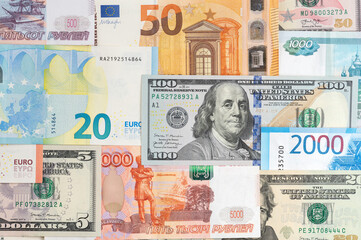 Money from different countries: dollars, euros, rubles. International currencies background.
