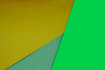 Dark and light, Plain and Textured Shades of yellow green blue papers background lines intersecting to form a triangle shape